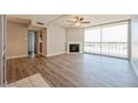 Inviting living room showcasing wood floors, a modern fireplace, and large windows with city views at 745 N Royal Crest Cir # 157, Las Vegas, NV 89169