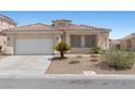 Lovely single-story house displaying desert landscaping, attached garage, and a well maintained front yard at 820 Peach Ave, North Las Vegas, NV 89032