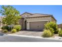 Lovely single-story home featuring desert landscaping, stone accents, and a two-car garage at 832 Gallery Course Dr, Las Vegas, NV 89148