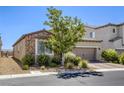 Charming single-story house with a two-car garage, desert landscaping, and a gated side yard at 832 Gallery Course Dr, Las Vegas, NV 89148