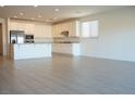 Spacious kitchen with white cabinets, stainless steel appliances, and tile floors with ample counter space at 832 Gallery Course Dr, Las Vegas, NV 89148