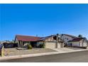 Charming single-story home with a two-car garage and a low maintenance front yard at 8517 Soneto Ln, Las Vegas, NV 89117