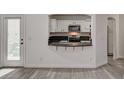 Modern kitchen featuring granite countertops, stainless steel appliances, and stylish white cabinetry at 9130 Beauchamp Ave, Las Vegas, NV 89148