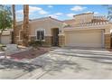 Charming one-story home featuring a low-maintenance yard and attached two-car garage at 9256 Blue Flax Pl, Las Vegas, NV 89148