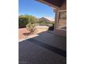 A view of a serene backyard with desert landscaping and ample privacy for outdoor enjoyment at 10036 Keysborough Dr, Las Vegas, NV 89134
