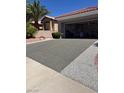 Long driveway leading to a two-car garage, providing ample parking space for residents and guests at 10036 Keysborough Dr, Las Vegas, NV 89134