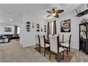 Stylish dining room with a modern glass table and seating for six, perfect for entertaining at 10045 Natchez Trace St, Las Vegas, NV 89178