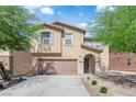 Charming home with two-car garage, low maintenance landscaping, and beautiful curb appeal at 10045 Natchez Trace St, Las Vegas, NV 89178