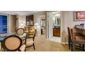 Inviting living area with a glass table, comfortable seating, and access to the bathroom at 135 E Harmon Ave # 2821, Las Vegas, NV 89109