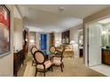 Inviting living area with a glass table, comfortable seating, and access to the balcony at 135 E Harmon Ave # 2821, Las Vegas, NV 89109