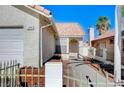 Lovely single-story home featuring a charming front entrance, complemented by a tile roof and mature desert landscaping at 1950 Turtlerock St, Las Vegas, NV 89142