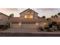 Charming two-story home with a three-car garage and well-maintained landscaping at 2105 Madagascar Ln, Las Vegas, NV 89117