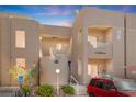 Inviting two-story condo showcasing well-maintained landscaping and a charming facade at 2243 Aspen Mirror Way # 102, Laughlin, NV 89029