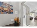 Hallway showcases art and decor, leading to the kitchen and living areas, enhancing the home's appeal at 2512 Huber Heights Dr, Las Vegas, NV 89128