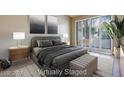 Comfortable bedroom featuring a king bed, soft lighting, and a patio exit at 2723 Seabridge Dr, Las Vegas, NV 89121