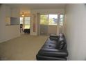 Spacious living room with sliding glass doors to balcony allowing ample natural light at 2831 Geary Pl # 2918, Las Vegas, NV 89109