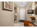 Inviting entryway with neutral walls and tile flooring, enhanced by decorative artwork and stylish furnishings at 3773 Blake Canyon Dr, North Las Vegas, NV 89032
