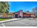 Charming single-story clubhouse featuring ample parking, large windows, and desert landscaping at 4036 Nightingale Ct, Las Vegas, NV 89107