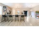 Stylish kitchen with an island, bar stool seating, stainless steel appliances, and ample counter space at 5009 Peaceful Pond Ave, Las Vegas, NV 89131