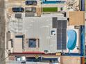 Aerial view of property showcasing the pool, solar panels, backyard, and surrounding neighborhood at 5093 Sun Valley Dr, Las Vegas, NV 89122