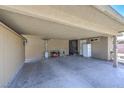 Spacious carport featuring concrete flooring, overhead lighting, and access to storage at 5093 Sun Valley Dr, Las Vegas, NV 89122