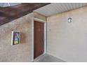 Condo entrance with dark brown door, visible unit number, and safety equipment at 5200 Indian River Dr # 301, Las Vegas, NV 89103
