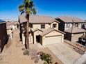 Charming two-story home featuring a tile roof, desert landscaping, and an attached two-car garage at 5308 Hollyridge St, North Las Vegas, NV 89081