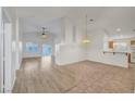 Bright living room featuring laminate flooring, natural light, and a seamless open concept design at 641 Bay Bridge Dr, North Las Vegas, NV 89032