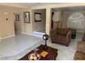 Bright living room showcasing tile flooring, neutral tones, and comfortable seating arrangements at 8225 Bermuda Beach Dr, Las Vegas, NV 89128