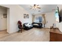 Bright living room with hardwood floors and a neutral color palette at 8550 Little Fox St, Las Vegas, NV 89123
