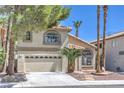 Beautiful two-story home with a well-kept lawn and an attached two-car garage at 8712 Texas Bronco Ave, Las Vegas, NV 89129