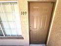 View of the front door of unit 109, showing the access point to the home at 9070 Spring Mountain Rd # 109, Las Vegas, NV 89117