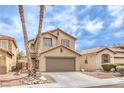 Charming two-story home featuring a two-car garage, desert landscaping, and tile roof at 9129 Patrick Henry Ave, Las Vegas, NV 89149