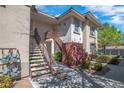 Exterior shot of an apartment building with stairs leading to upper-level units at 913 Duckhorn Ct # 201, Las Vegas, NV 89144