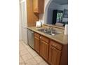 Kitchen with stainless steel dishwasher, double sink, and light wood cabinets at 1515 E Reno Ave # D202, Las Vegas, NV 89119