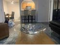 Bright living area with modern decor, bar seating area and partial view of kitchen at 1515 E Reno Ave # D202, Las Vegas, NV 89119