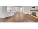Spacious living area with wood-look floors, fireplace, and an open layout perfect for modern living at 2050 W Warm Springs Rd # 4512, Henderson, NV 89014