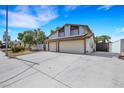 Two-story home with a spacious driveway and a two-car garage at 3746 E Harmon Ave, Las Vegas, NV 89121