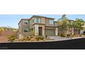 Stunning home with a two-car garage, landscaped front yard, and modern architecture at 389 Red Feather Peak Ct, Las Vegas, NV 89138