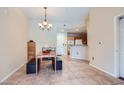Inviting dining area with natural light, neutral walls and adjacent to an open kitchen at 43 E Agate Ave # 302, Las Vegas, NV 89123