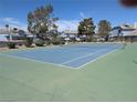 Enjoy a friendly match on the community's well-maintained tennis court with trees and landscaping at 5420 Centurion Ct # 104, Las Vegas, NV 89122