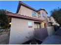 Charming two-story townhouse featuring stucco siding, a tile roof, and well-maintained landscaping at 558 Roxella Ln # D, Las Vegas, NV 89110