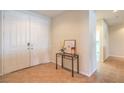 Bright entryway showcasing tile flooring, double doors, and a decorative console table with accents at 5889 Wildhorse Ledge Ave, Las Vegas, NV 89131