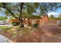 Expansive front yard with lush greenery, large trees, and charming exterior at 7517 Elk Meadows Ct, Las Vegas, NV 89131