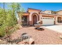 Attractive home with a drought resistant front yard, mature tree, and dolphin fountain at 7929 Palace Monaco Ave, Las Vegas, NV 89117
