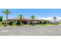 Beautiful single-story home with a tile roof and mature landscaping at 8574 Verde Park Cir, Las Vegas, NV 89129