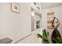 Inviting foyer featuring wood floors, recessed lights and decorative art at 8955 Ruby Moon Dr, Las Vegas, NV 89139