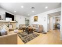 Inviting living room featuring a stone fireplace, neutral furniture, and ample natural light at 1001 Sulphur Springs Ln # 202, Las Vegas, NV 89128