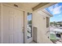 Front door with sidelight window, providing ample natural light at 1881 W Alexander Rd # 2093, North Las Vegas, NV 89032