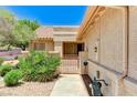 Home exterior featuring an iron gate and covered entry way at 2035 E Warm Springs Rd # 1019, Las Vegas, NV 89119